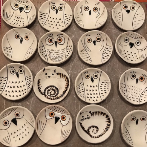 Small porcelain owls and cats